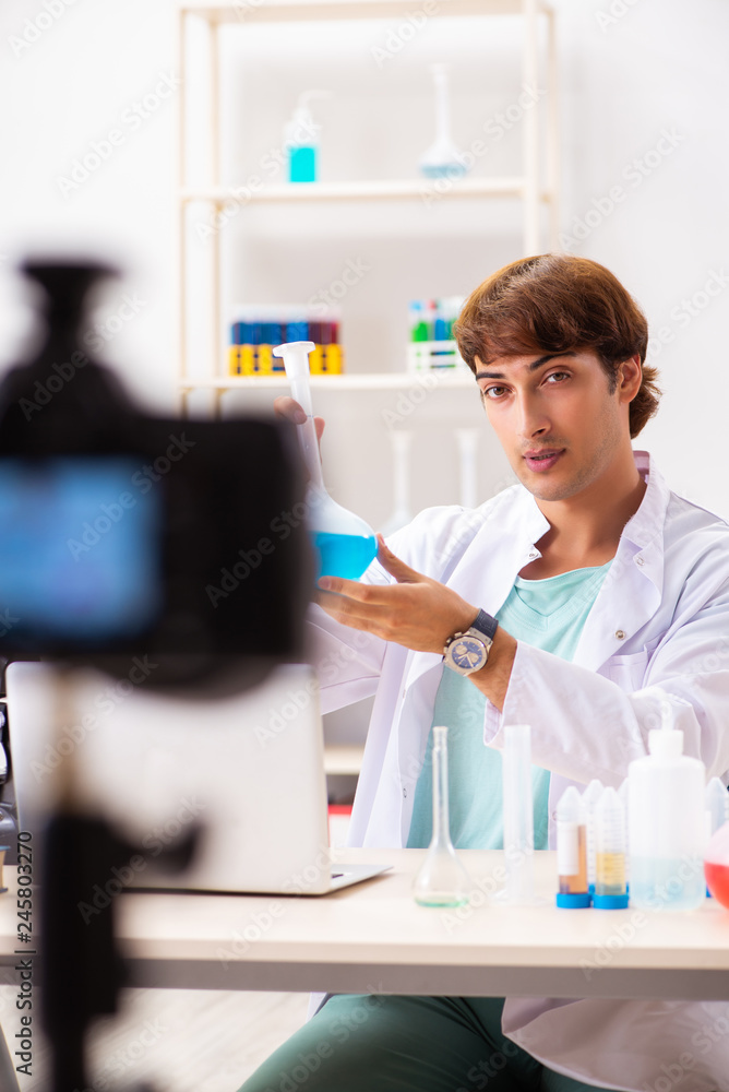 Chemist blogger recording video for his blog Chemist blogger recording video for his blog