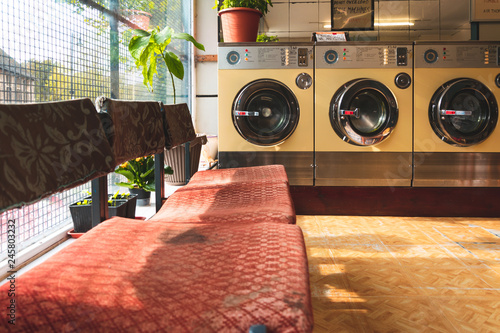 Coin-operated washing machines at a vintage laundromat