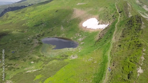 Bird's-eye view of the mountain landscape and highland lake Nesamovyte. Carpathians. Ukraine