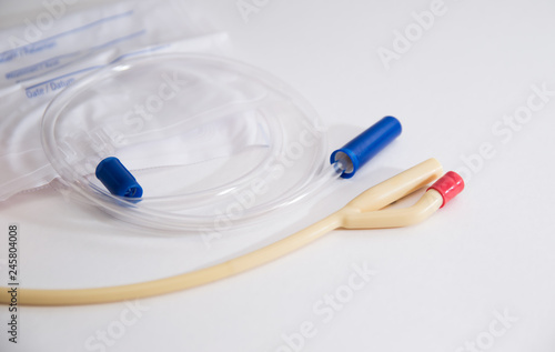 catheter with urinal bag are on a white background, dropper photo