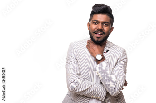 Handsome happy beard young man smiling and holding his chin isolated on white background