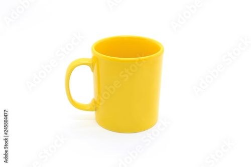 Bright yellow ceramic cup on white background