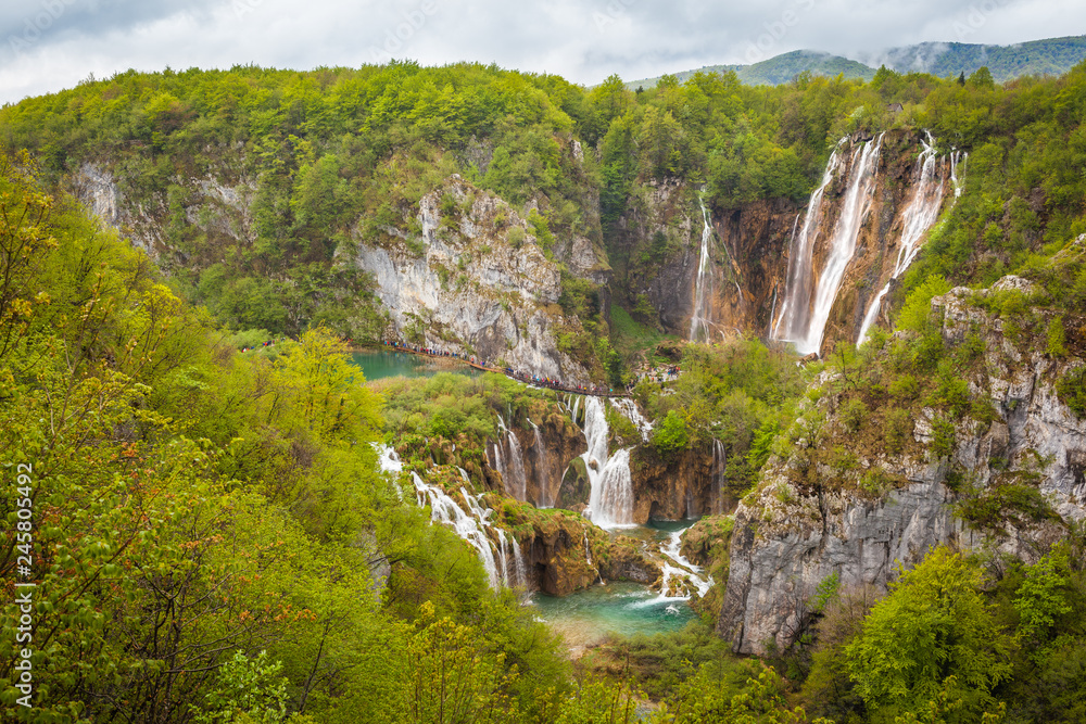Breathtaking view of majestic waterfalls and green forests, Plitvice Lakes National Park, Croatia