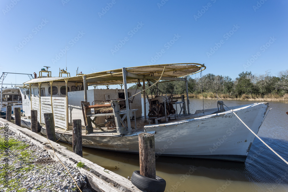 Vintage fishing boat tied to dock
