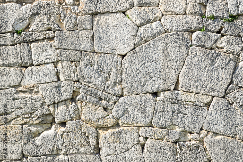 Polygonal walls built from the 7th to the 2nd century BC. The large boulders are interlocked with each other without lime Polygonal walls built from the 7th to the 2nd century BC. The large boulders are interlocked with each other without lime