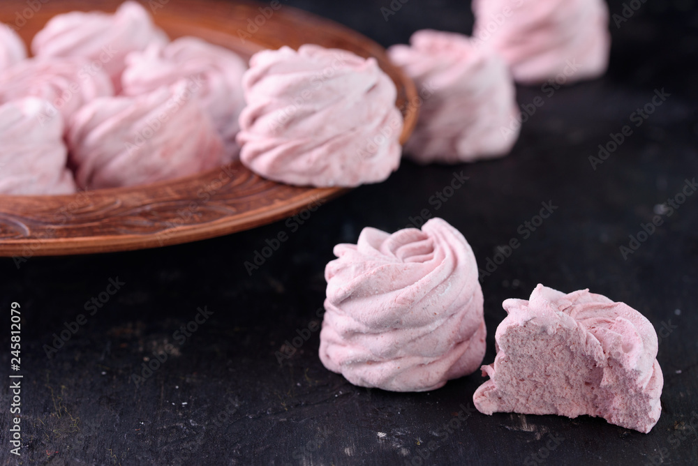 Spicy dessert with red pepper. Marshmallow Delicious and appetizing marshmallow with taste of red pepper on a black background. Spicy dessert with red pepper. Marshmallow Delicious and appetizing marshmallow with taste of red pepper on a black background.