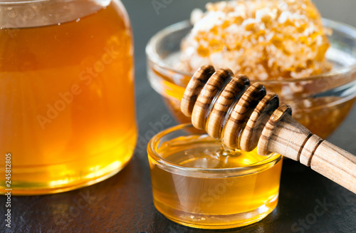 Glass jars filled with fresh honey