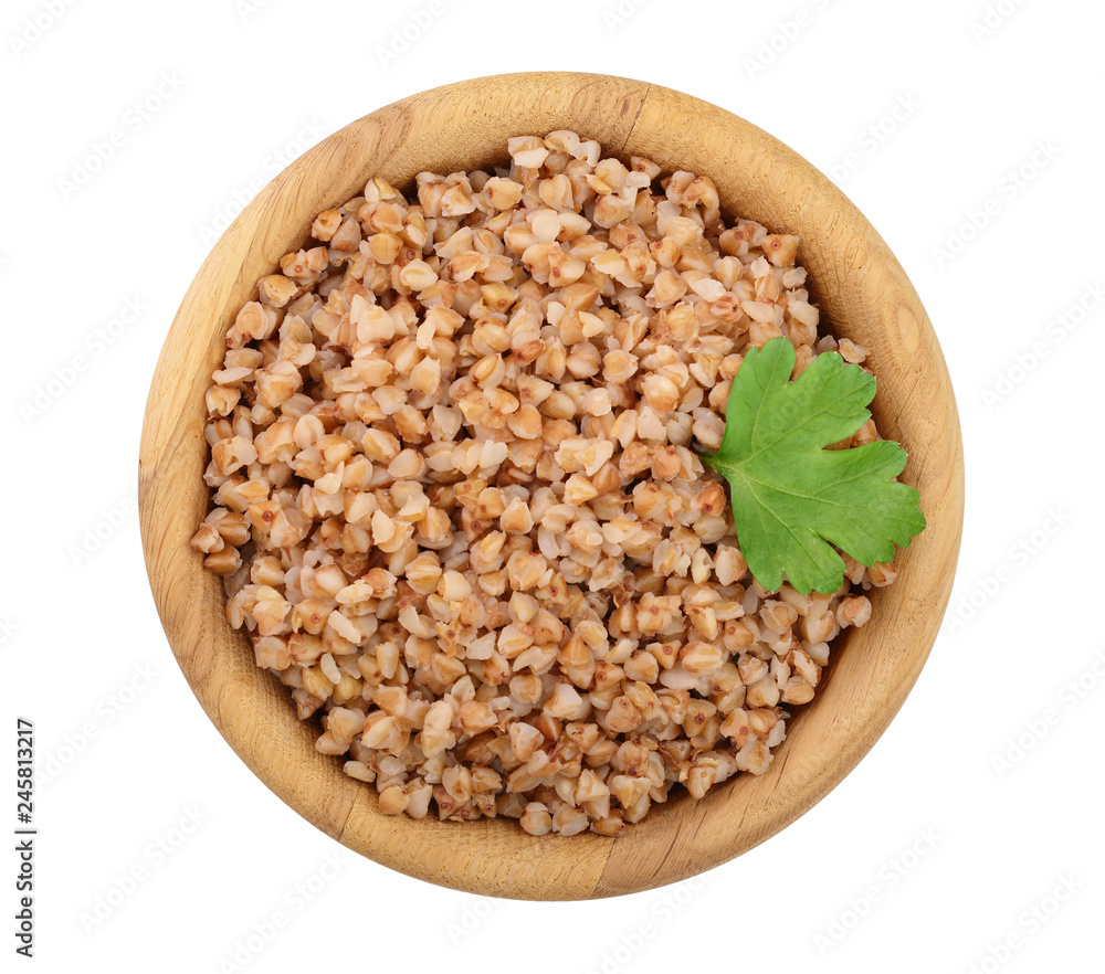 Buckwheat porridge in wooden bowl isolated on white background. Top view Buckwheat porridge in wooden bowl isolated on white background. Top view
