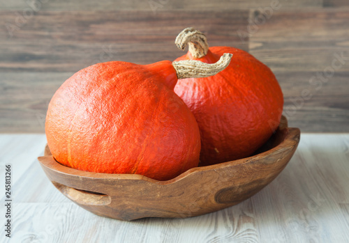  Ripe orange pumpkins on wooden salver photo