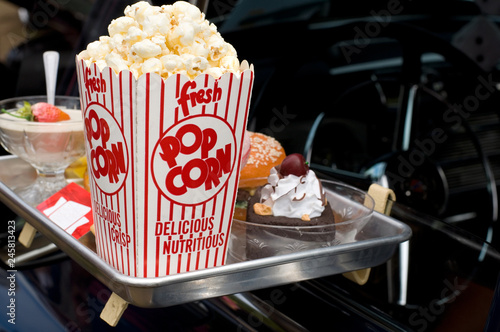 Imitation of Food and Popcorn in a Food Drive-Thru with Antique Car photo