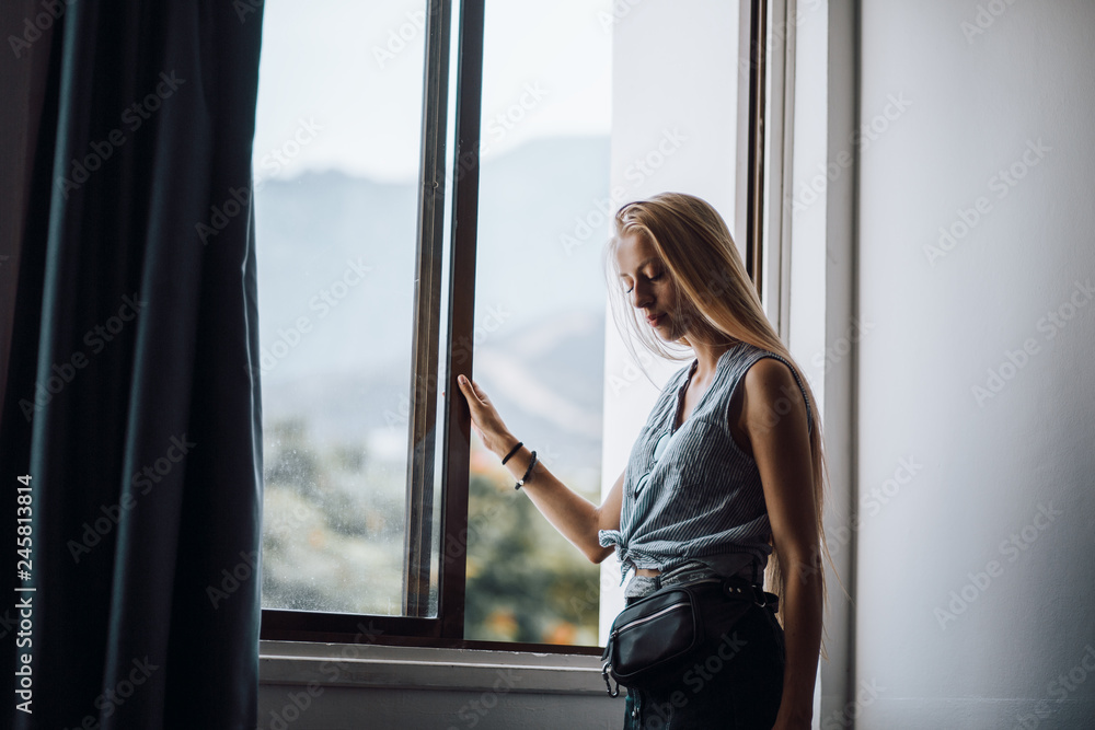 Beautiful girl by the window Beautiful girl by the window