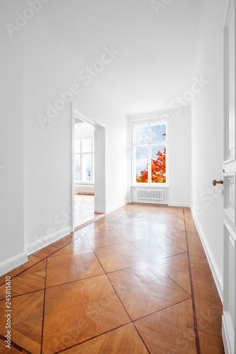 empty room with historic parquet floor newly renovated old building  - -