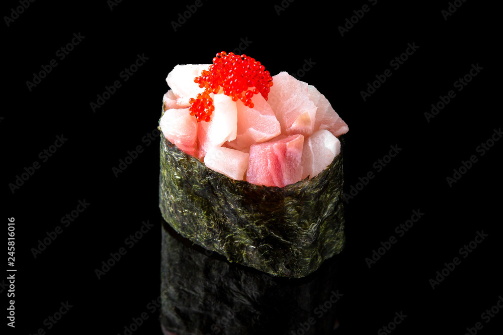 Gunkan Maki Sushi with perch (tai) and tobiko caviar on black background. Sushi menu. Japanese food. Gunkan Maki Sushi with perch (tai) and tobiko caviar on black background. Sushi menu. Japanese food.