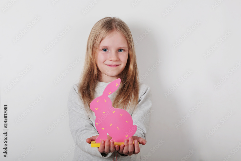 Beautiful little blond girl with Easter rabbit on white background Beautiful little blond girl with Easter rabbit on white background