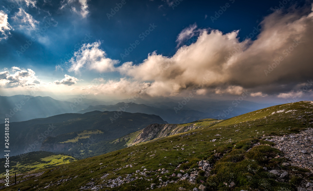 View from Rax plateau from Klosterwappen, highest peak of Schneeberg on Puchberg valley with dramatic cloudy sky, Alps, Lower Austria