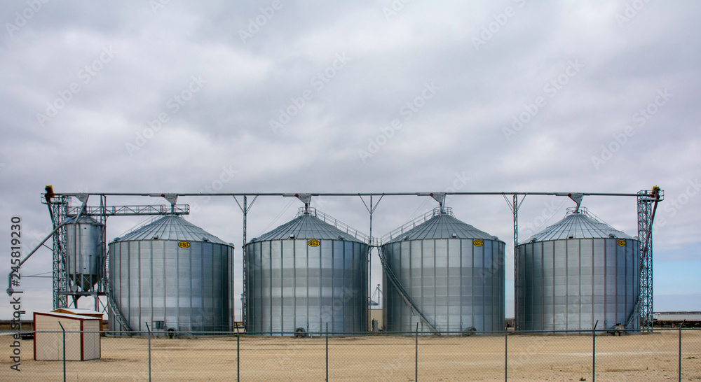 Grain silos on the side of the road Grain silos on the side of the road