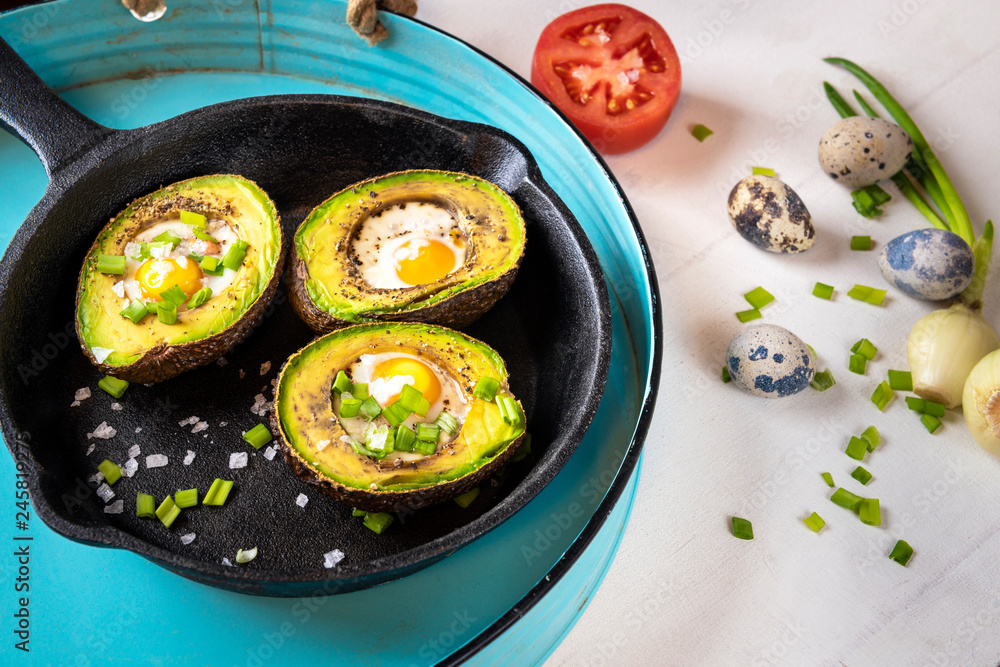 Avocado baked with quail eggs, fresh onion Avocado baked with quail eggs, fresh onion
