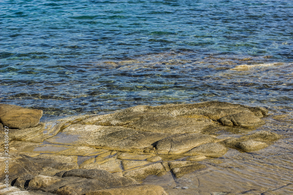 Obraz premium local scenic landscape of stone near rocky shoreline coast of tropic south sea wallpaper background concept photography with empty copy space for your text or inscription 
