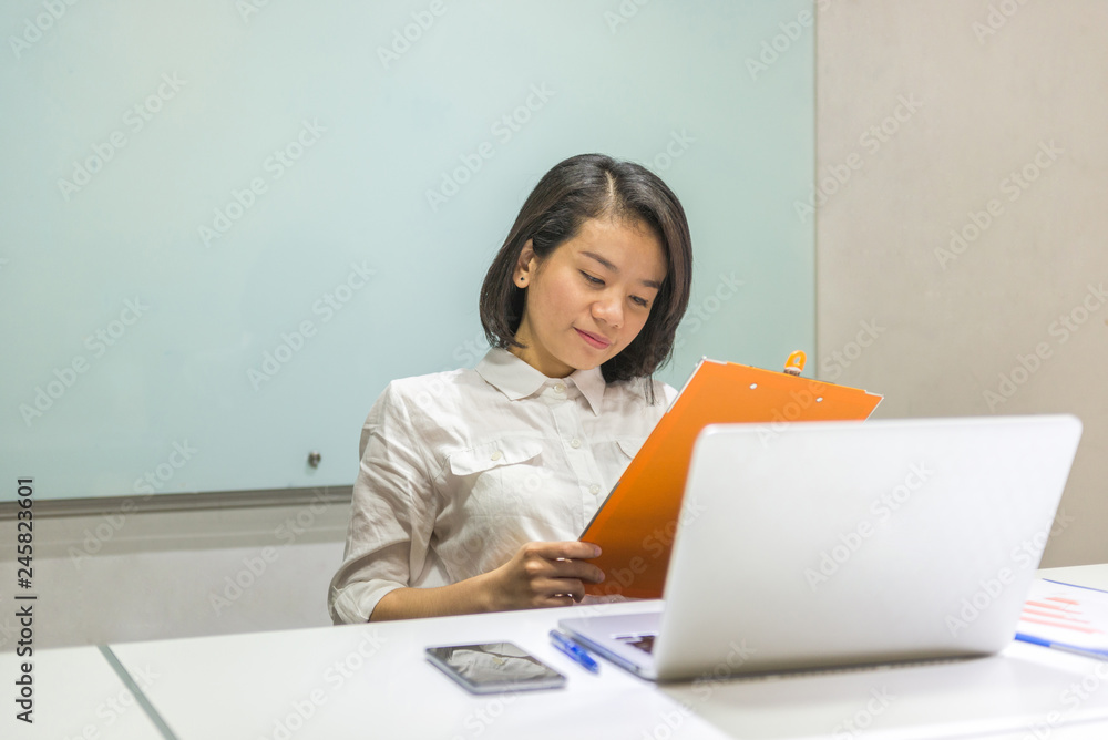 Office woman reading finance report in the office Office woman reading finance report in the office