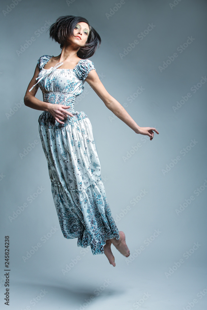 Fototapeta premium beautiful fairy flying girl in blue dress 