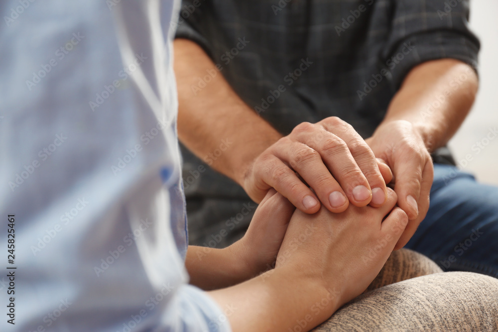 Man comforting woman, closeup of hands. Help and support concept Man comforting woman, closeup of hands. Help and support concept