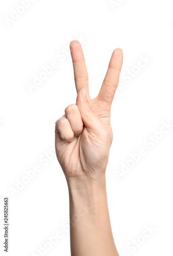 Woman showing V letter on white background, closeup. Sign language