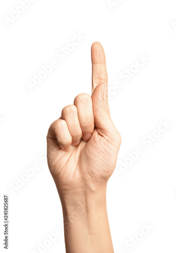 Woman showing number one on white background, closeup. Sign language