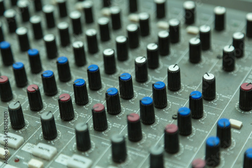 sound mixer with selective focus, buttons equipment in audio recording studio