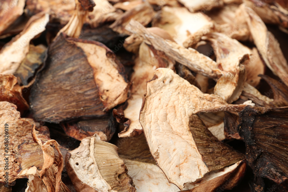 Delicious dried slices of mushrooms as background, closeup view Delicious dried slices of mushrooms as background, closeup view