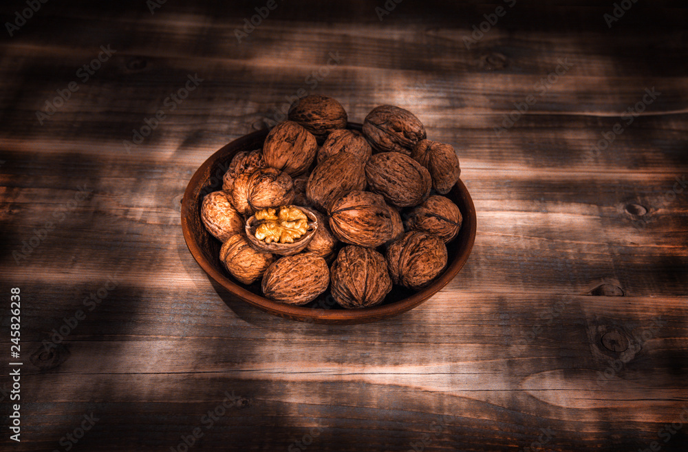 Fototapeta premium nuts, healthy nutritional food. walnut close-up on a wooden background.
