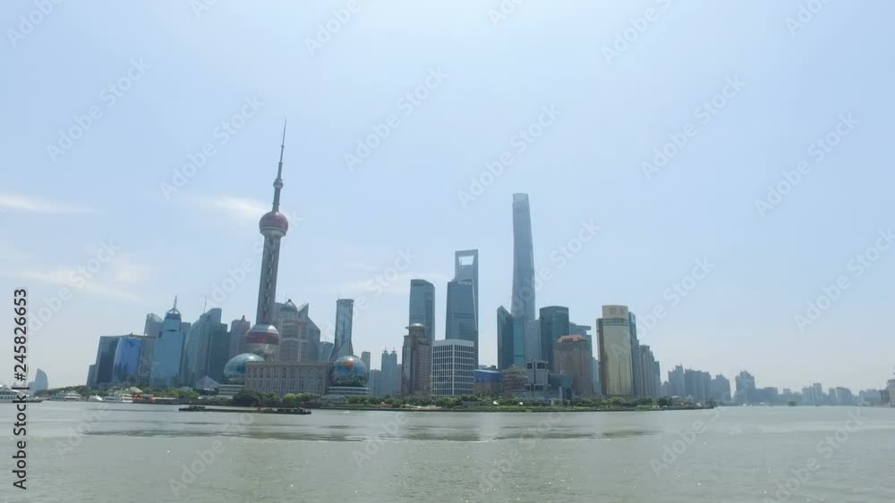 Runner running in city of Shanghai, China on famous boardwalk with skyline. Urban city lifestyle. Active Asian woman training outside jogging on the Bund. Action camera Runner running in city of Shanghai, China on famous boardwalk with skyline. Urban city lifestyle. Active Asian woman training outside jogging on the Bund. Action camera