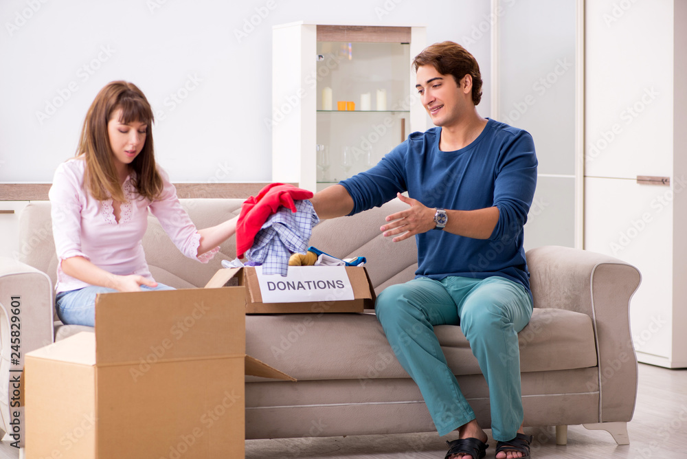 Concept of charity with donated clothing Concept of charity with donated clothing