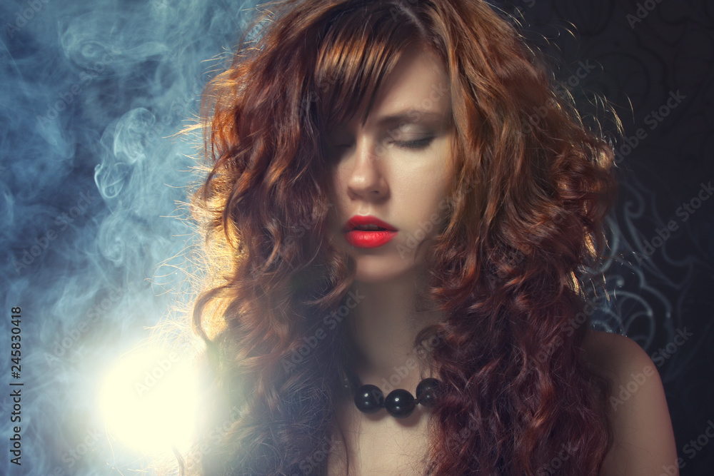 Fototapeta premium young and sexy woman in smoke 