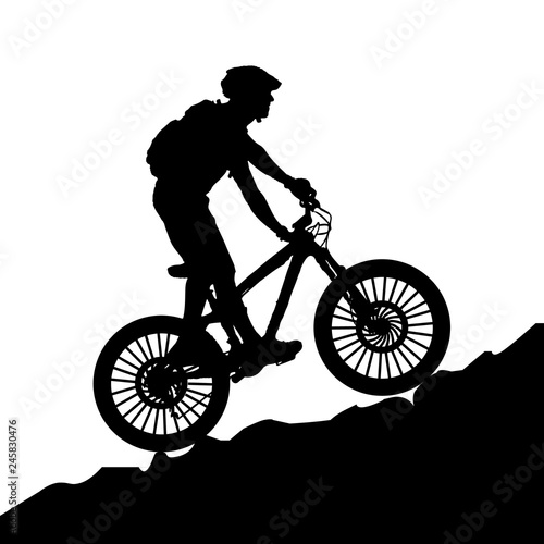 A bicycle riding bike in rocky area. Illustration on mountain bike - silhouette.