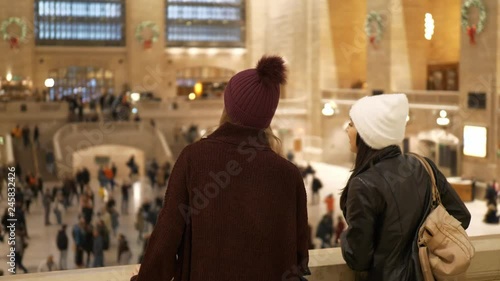 Two friends travel to New York for sightseeing and enjoy Grand Central Station