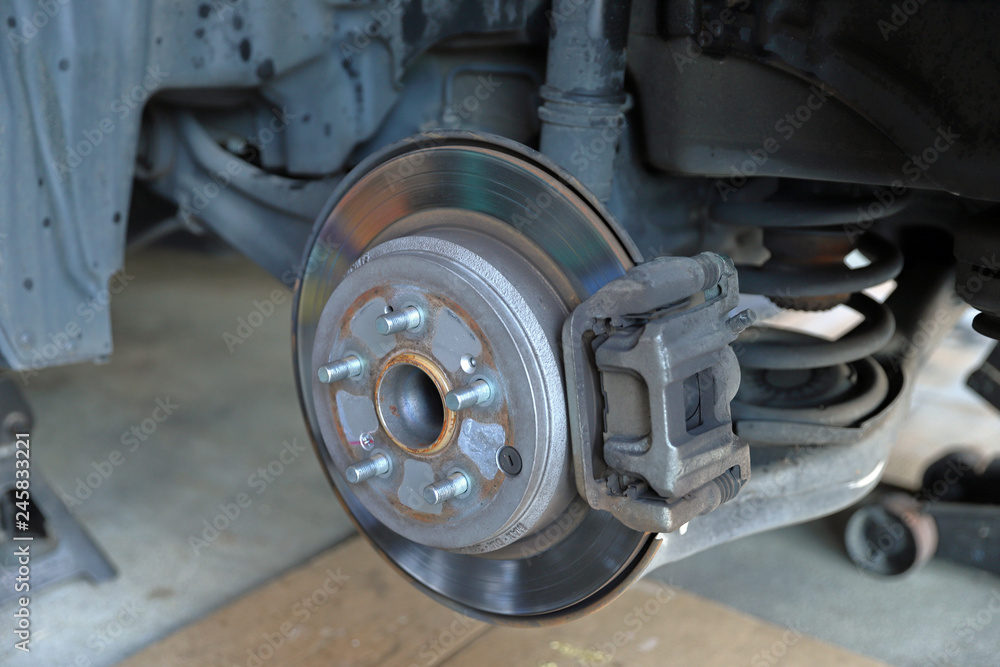 Disc brake rotor and pads on a vehicle Disc brake rotor and pads on a vehicle