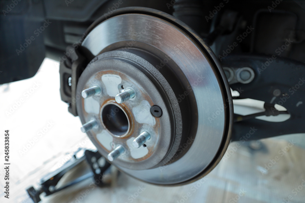 Disc brake rotor and pads on a vehicle Disc brake rotor and pads on a vehicle