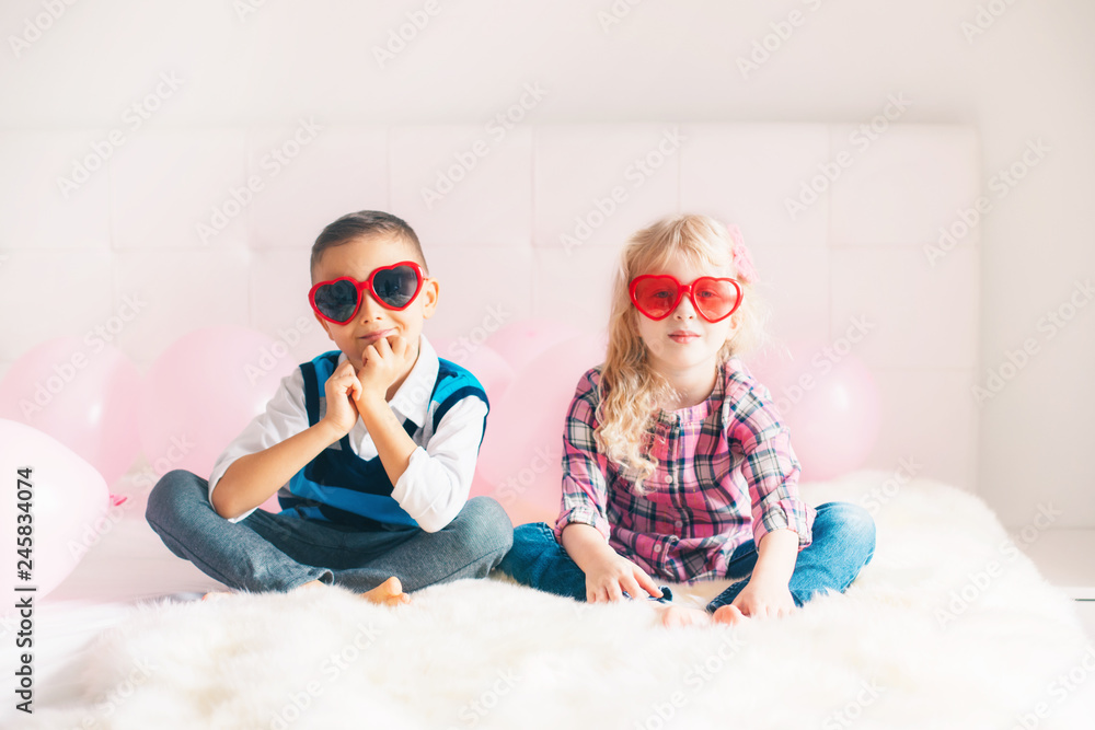 Group Portrait Of Two Happy White Caucasian Cute Adorable Funny Children Boy And Girl Wering Heart Shaped Glasses Love Friendship And Fun Best Friends Forever Valentine Day Holiday Celebration Stock Photo Group Portrait Of Two Happy White Caucasian Cute Adorable Funny Children Boy And Girl Wering Heart Shaped Glasses Love Friendship And Fun Best Friends Forever Valentine Day Holiday Celebration Stock Photo