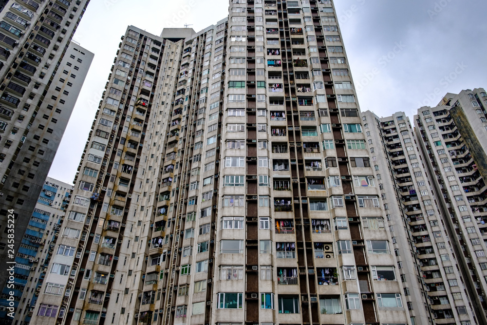 Naklejka premium High multistoried apartment buildings in residential city district. Abstract urban background.