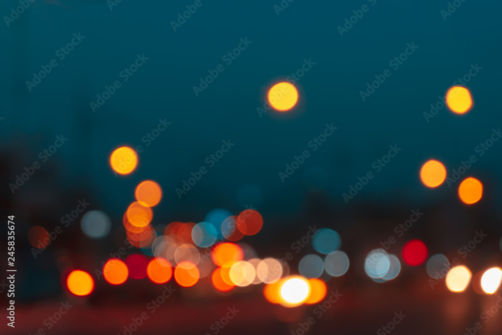 Abstract blurred light in night time of urban with bokeh background. - obrazy, fototapety, plakaty 
