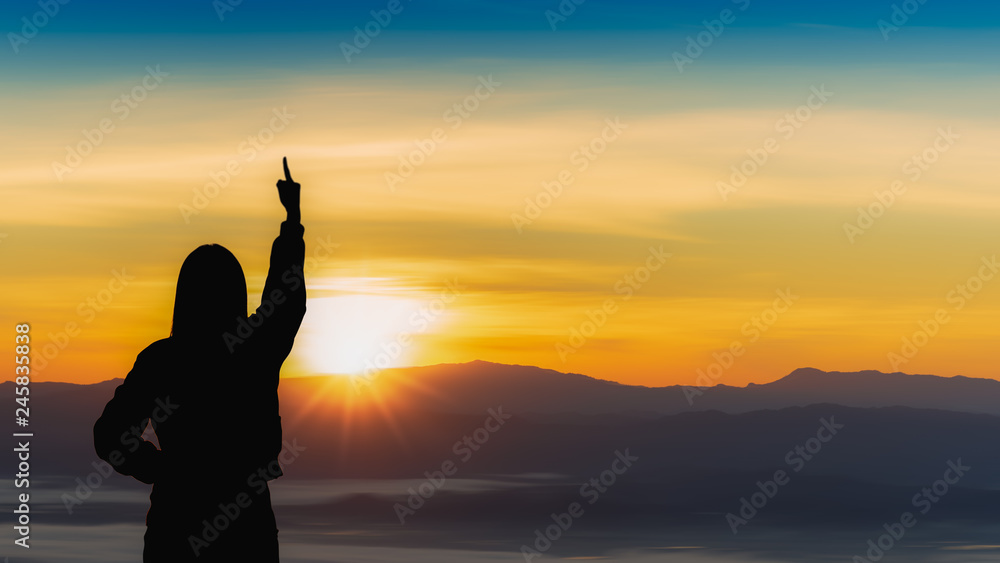 Young traveler woman raise hands up for her success with sunset on mountain natural background.