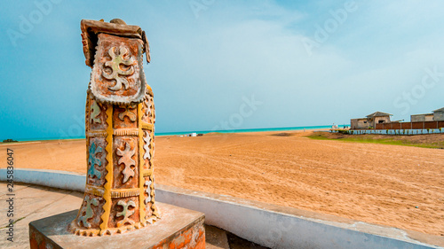 View from behind a statue overlooking ocean. The door of no return. Benin Africa.