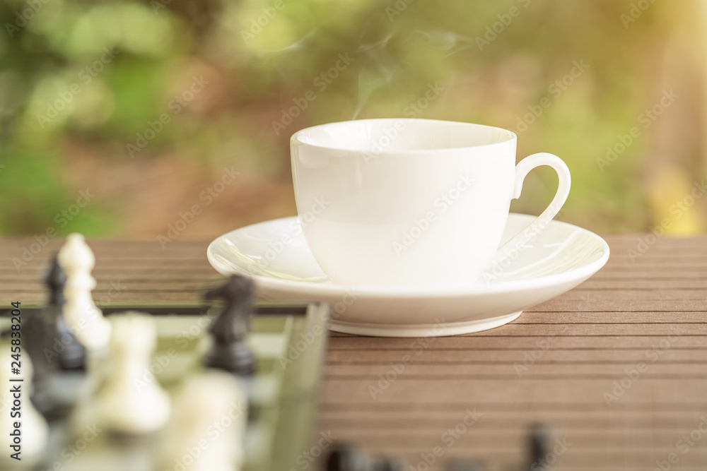 Coffee cup on table with Chess board Coffee cup on table with Chess board