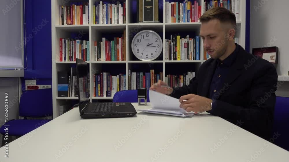 Businessman signs a document Businessman signs a document