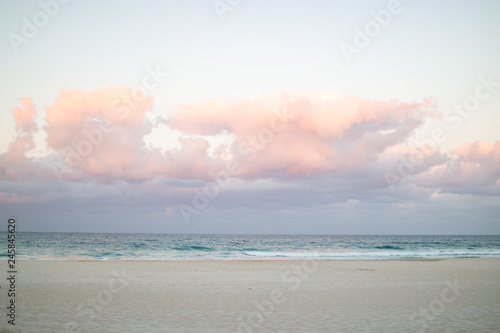 beach and sea pink sky clouds