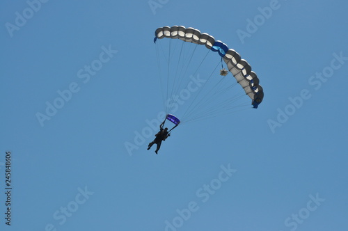 Two Men Skydiving with a Parachute