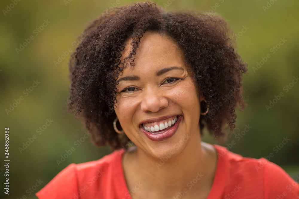 Fototapeta premium Confident Happy African American Woman Smiling Outside