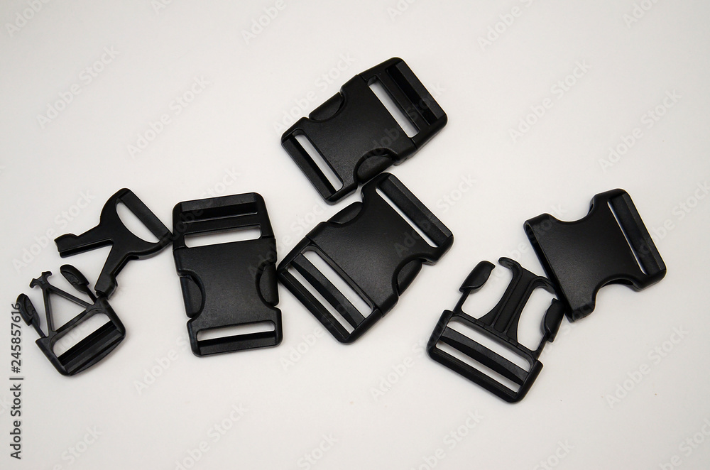 three-point black fastex lies on a white background three-point black fastex lies on a white background