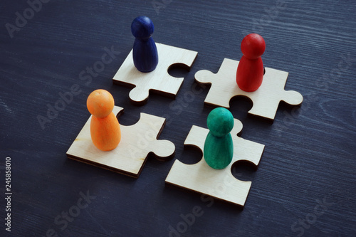 Employee relations and teamwork concept. Pieces of puzzles. photo