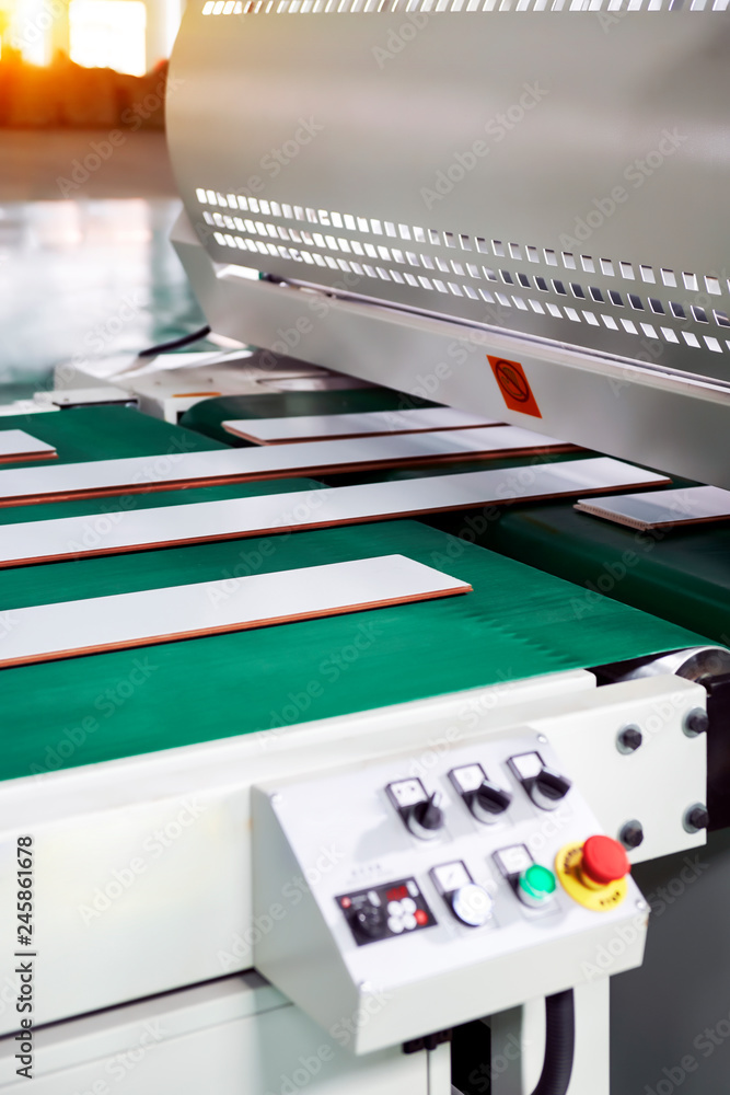 Large factory machinery for wood flooring is being automated Large factory machinery for wood flooring is being automated